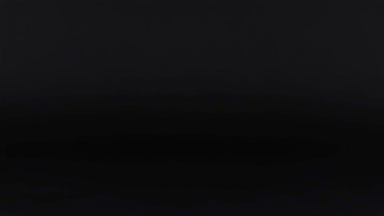 A red ball moves through a grid pattern against a dark backdrop, showcasing dynamic motion.