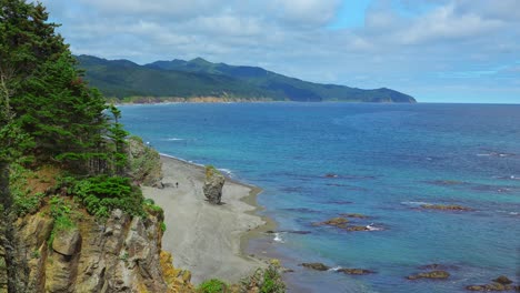 coastal scenery with rocky shore and mountains