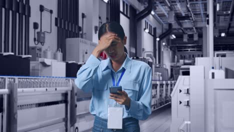 asian female with her smarphone with water production in bottling factory, she is nodding her shead with dissapionted