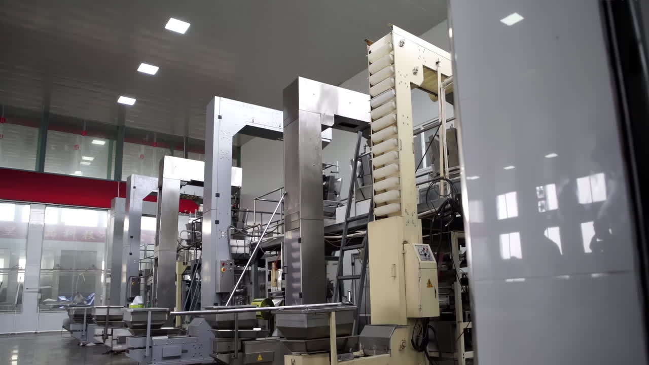 Close Up of food cake factory on an assembly line, automated Cookies on a Conveyor Belt Production Line in a Factory, ready for packaging and distribution.