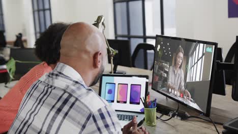 African-american-business-people-on-video-call-with-caucasian-female-colleague-on-screen