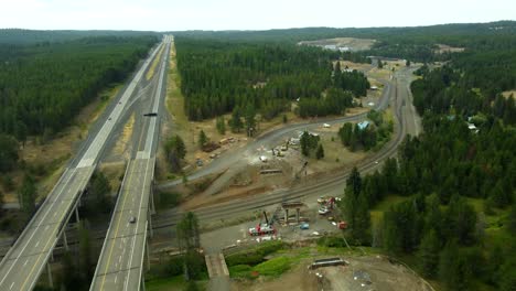 us, oregon, meacham, 2025-08-03 - drone view of the construction of a new bridge going over a railroad in the mountains, next to i84