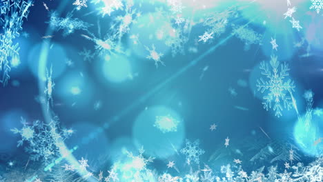 animation of snow falling over blue background with bokeh