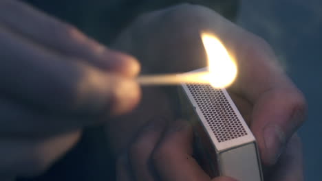 lighting a match at night - slowmotion