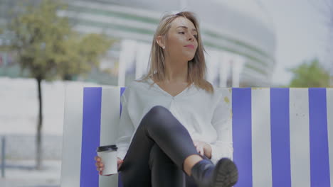 beautiful woman with coffee to go outdoor