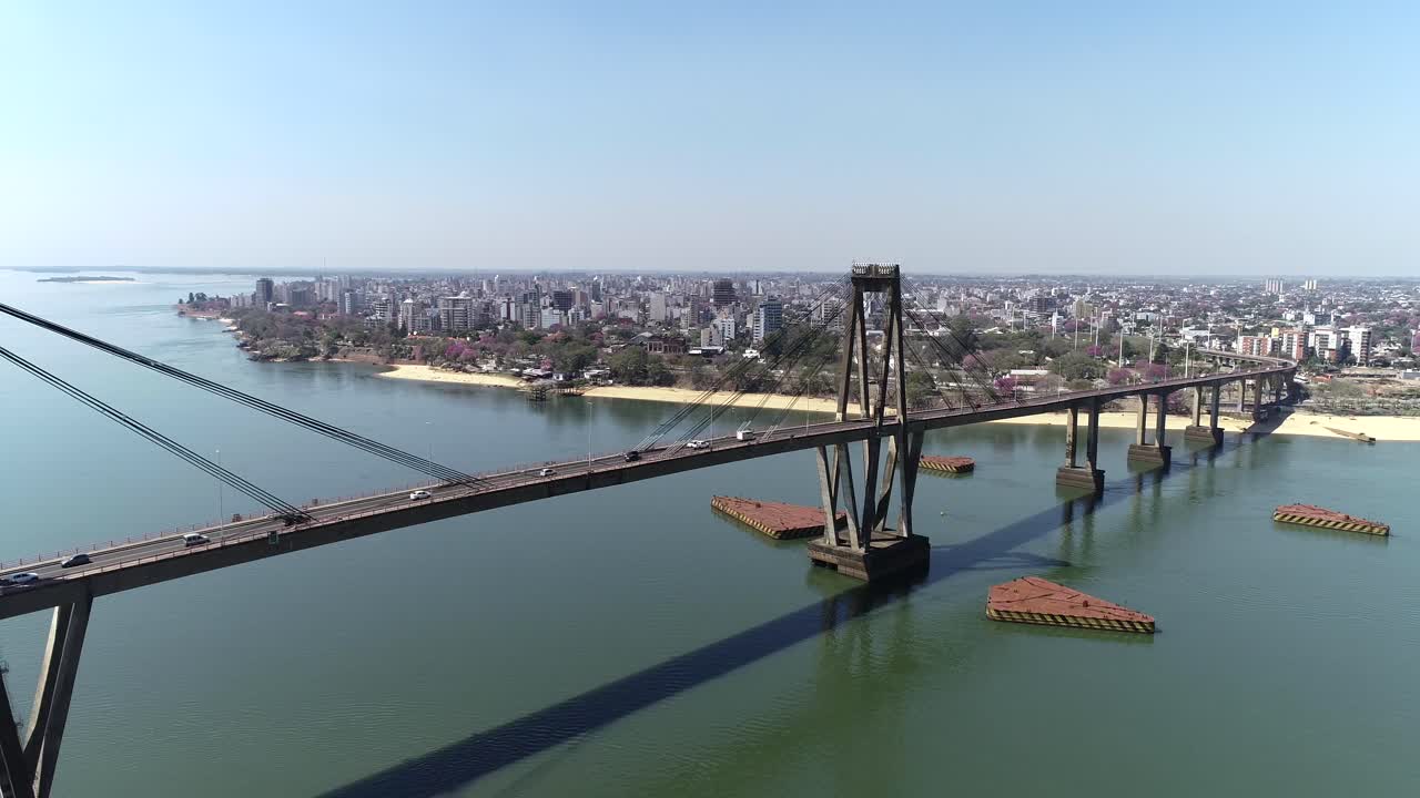 Bird's-eye view of the Puente General Manuel Belgrano, the Paraná River, and the city of Corrientes in the background