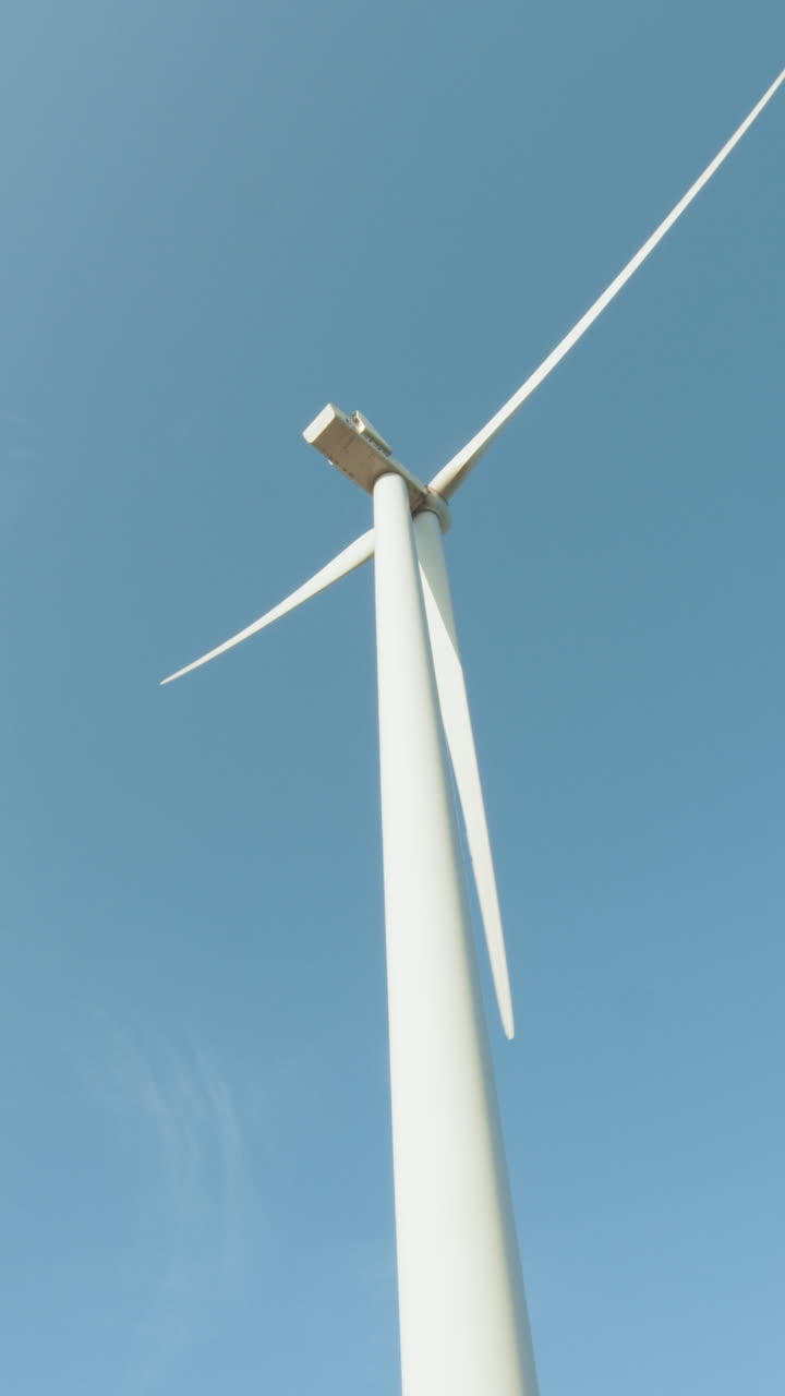 Wind turbine against blue sky