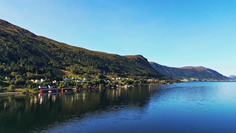 aerial over syvde waterfront on a lovely sunny day, vanylven municipality, norway