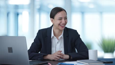 happy indian female manager talking to employees