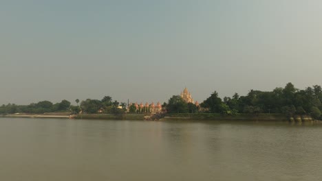 The-Dakshineswar-Kali-Temple-is-seen-from-the-jetty-ghat-or-ferry-boat-with-the-Hooghly-River-in-the-foreground