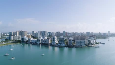 aerial forward dolly over bay into golden gate point in sarasota florida