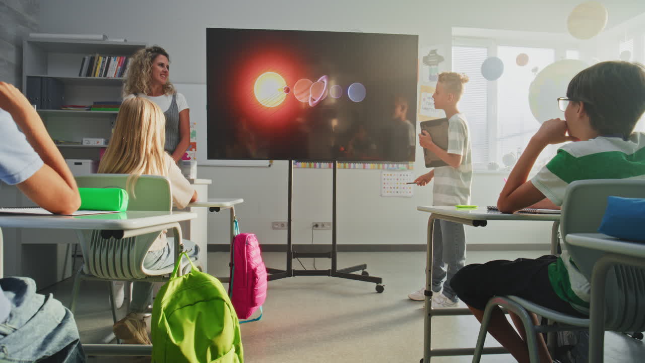 Primary School Boy Showcasing Knowledge Using Digital Screen with Chromakey Mockup
