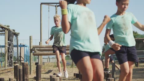 group of caucasian children training at boot camp
