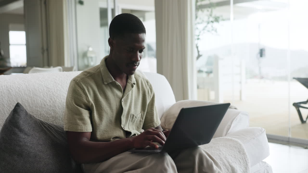Man working on laptop at home