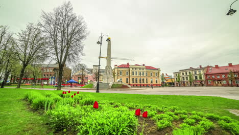 cesis, latvia town square - spring pull back, ascending motion time lapse