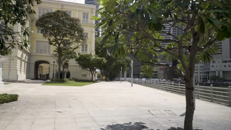 scene on empty streets at urban river with skylines in background during covid 19 pandemic in singapore