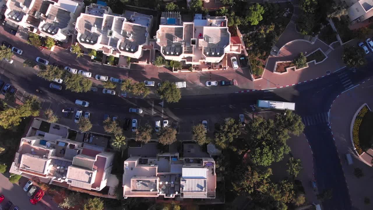 Aerial View of a Residential Urban Area with Streets, Buildings, and Traffic