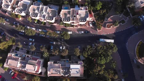 aerial view of a residential urban area with streets, buildings, and traffic