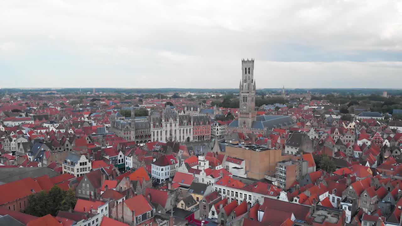 Cultural city center with Bell Tower and Market Square, Bruges, aerial HD