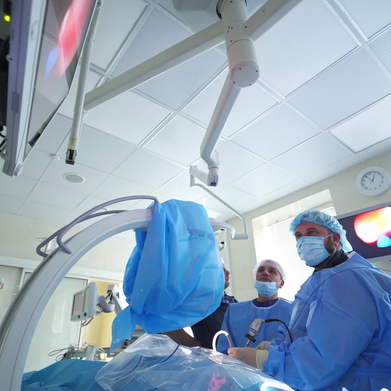 Serious surgeon team performing surgery. Doctors during surgical operation on patient