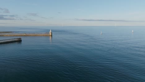 drone clip showing natural patterns of water movement and sea currents around a harbour