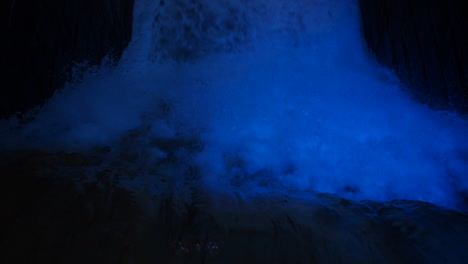 Top-down-view-of-a-river-waterfall-at-night