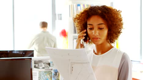 female architect talking on mobile phone 4k