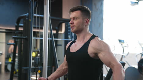 muscular sportsman power lifting heavy weight. muscular bodybuilder handsome man doing exercises in gym
