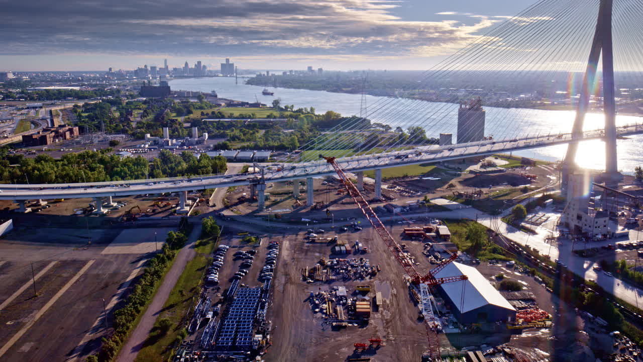 Drone shot flying in a smooth cinematic arc around the bridge uniting Canada and the United States