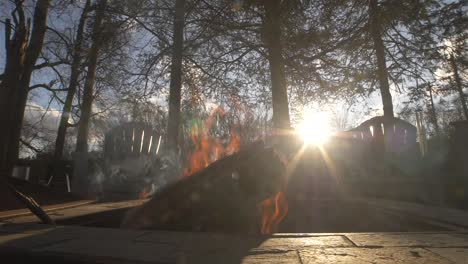 fire pit slow motion with sunset backyard trees