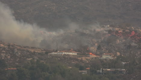 Forest-fire-on-the-hill-burned-houses,-homes-in-danger-of-fire,-wildfire-season-destoys-structures