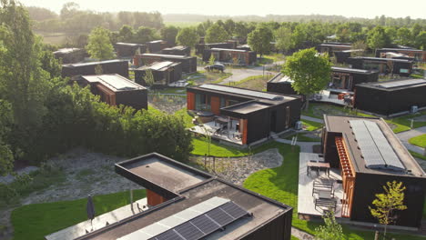 Flying-Over-The-Lodges-With-Sola-Panels-On-The-Roof-In-Roompot-Beach-Resort-Brouwersdam-In-Zeeland,-Netherlands