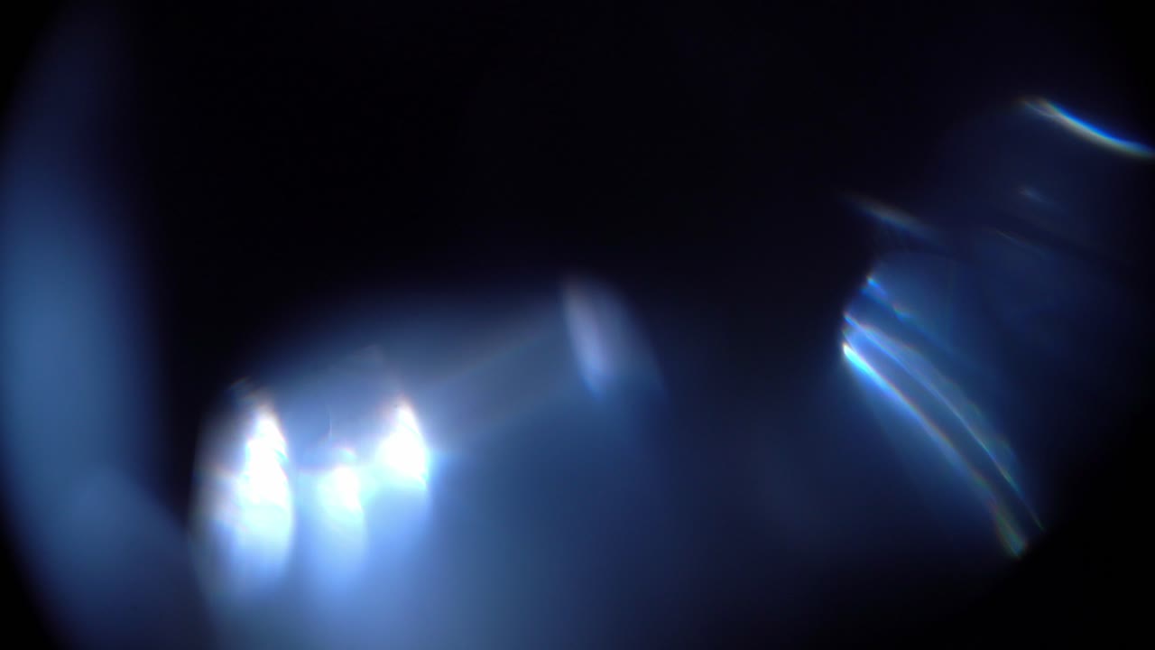 Abstract Blue Light Leaks and Lens Flares on Dark Background