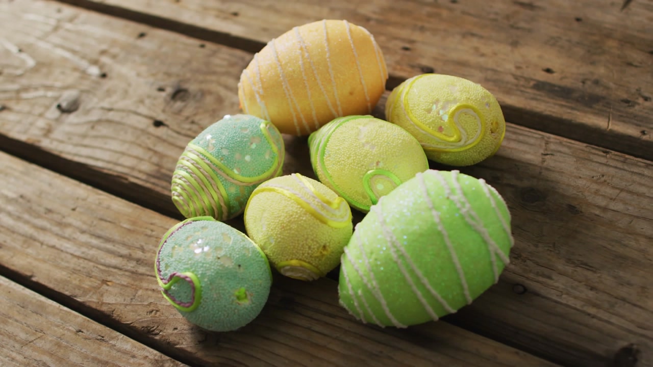 Pastel Easter egg cluster on board overlay appearing camera panning focusing HAPPY EASTER for promo