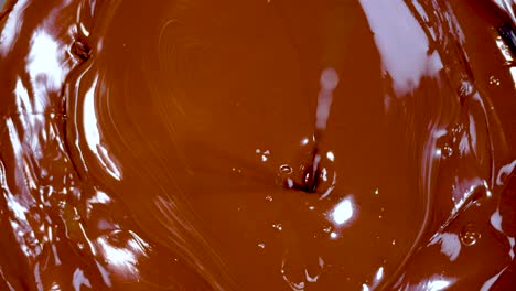 chocolate melting and swirling in close-up view