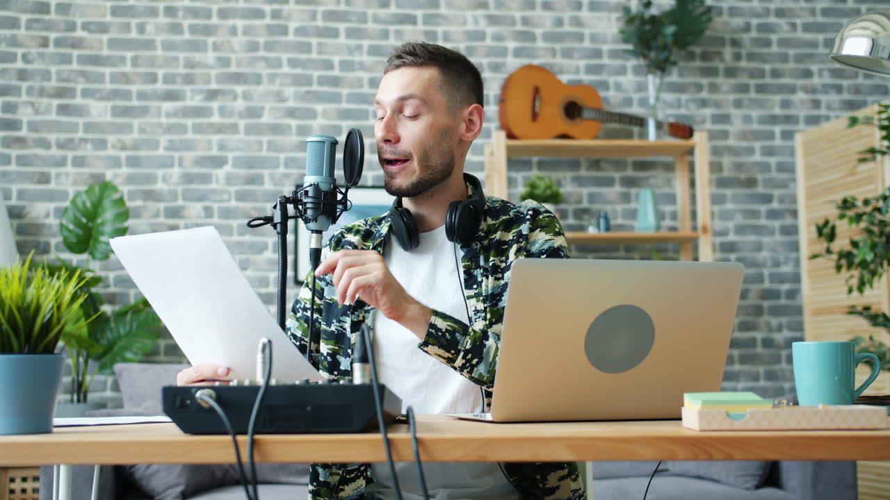 Man recording music at home studio