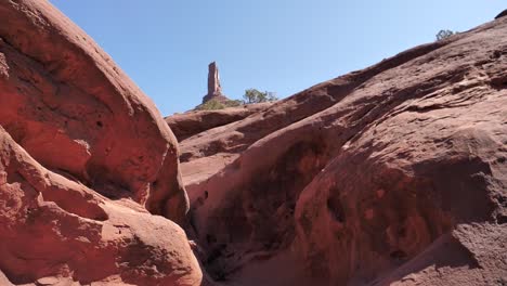 SLO-MO-walking-up-to-moab-castleton-tower-on-a-bright-day