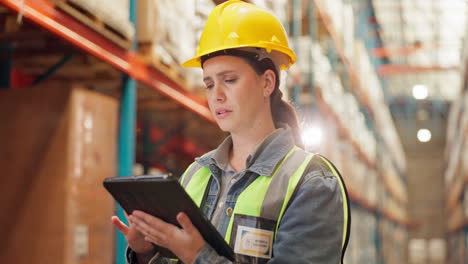 a worker in a warehouse using a tablet