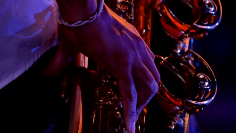 4k closeup saxophonist plays on golden saxophone. live jazz music