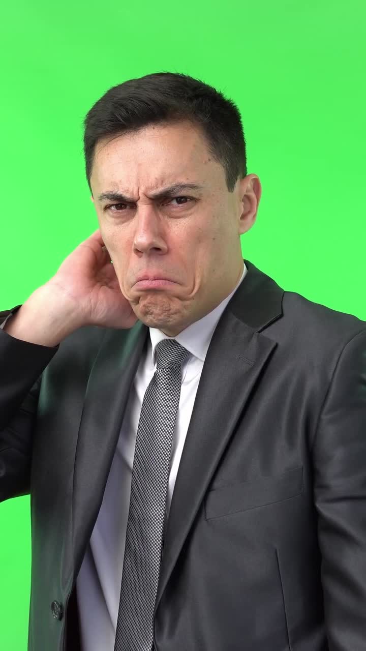 Businessman Reacting with Disgust and Disapproval on Green Screen
