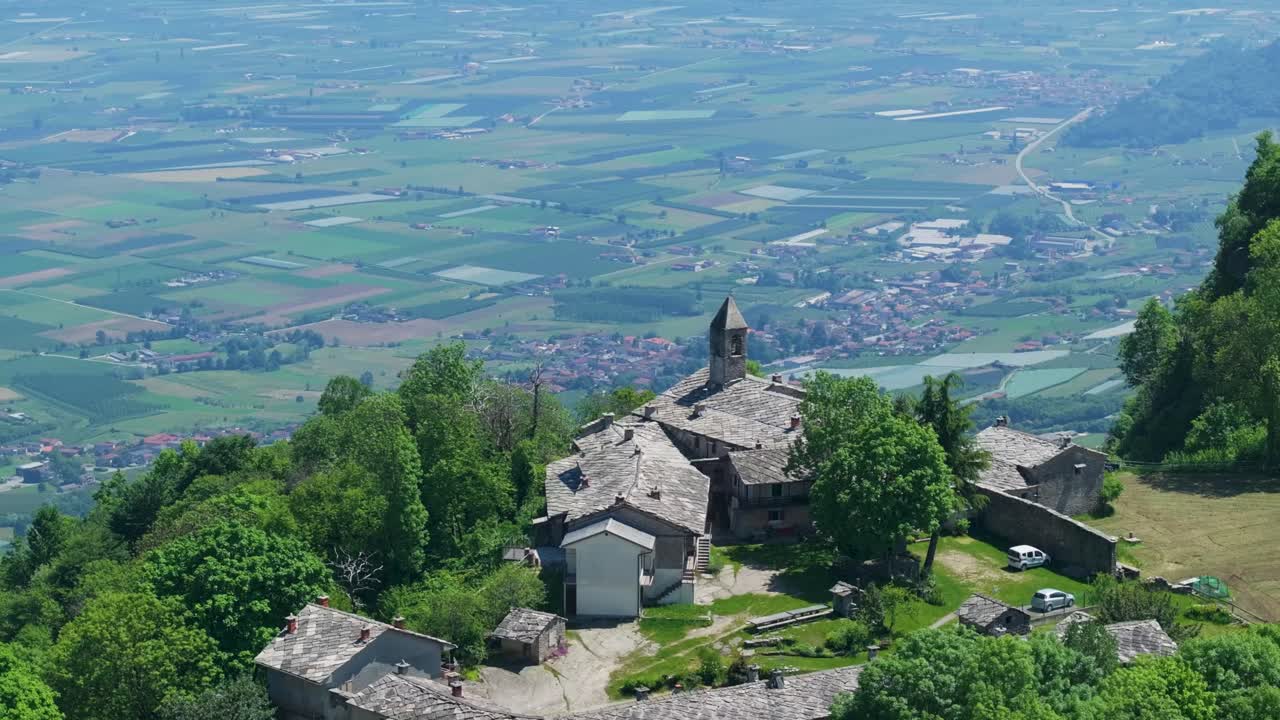 Rising aerial drone shot over Cima Bracco, the summit of Mombracco mountain in the Cottian Alps, Piemonte, Italy, revealing the magnificent alpine landscape and Croce di Envie monument