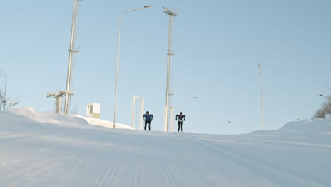 cross-country skiers on a snowy track