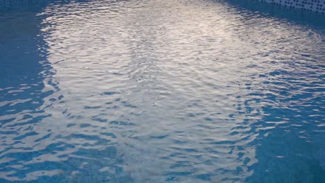 the water swirling on the surface of a swimming pool