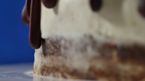 close-up of a chocolate drizzled cake