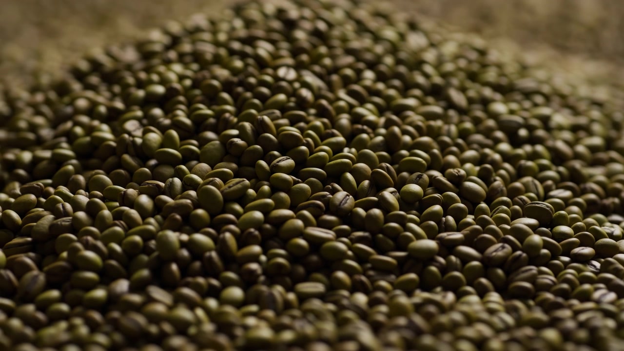 A close-up view of a heap of small, round objects, possibly seeds or grains, with a neutral mood and natural lighting. This scene is food industry, agriculture, and natural foodst.
