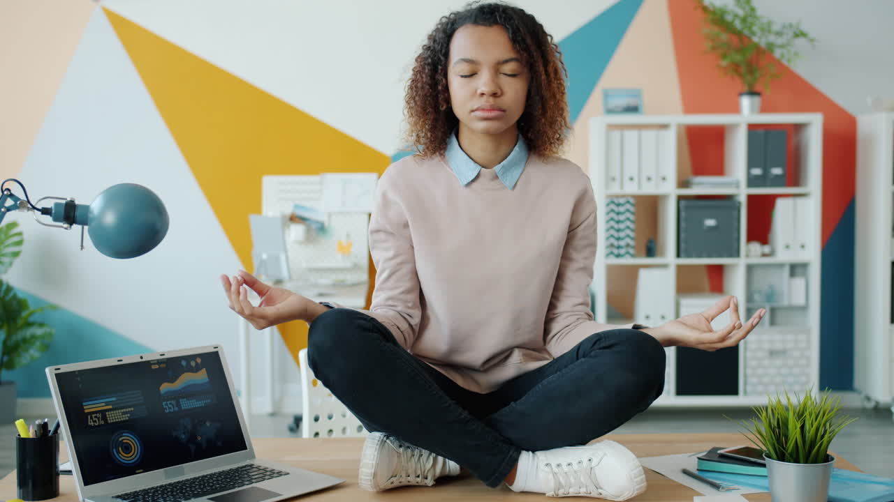 Woman Meditating in the Office