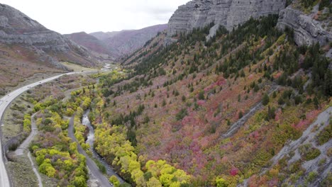 pavement road along provo canyon near bridal veil falls during autumn season in utah, united states