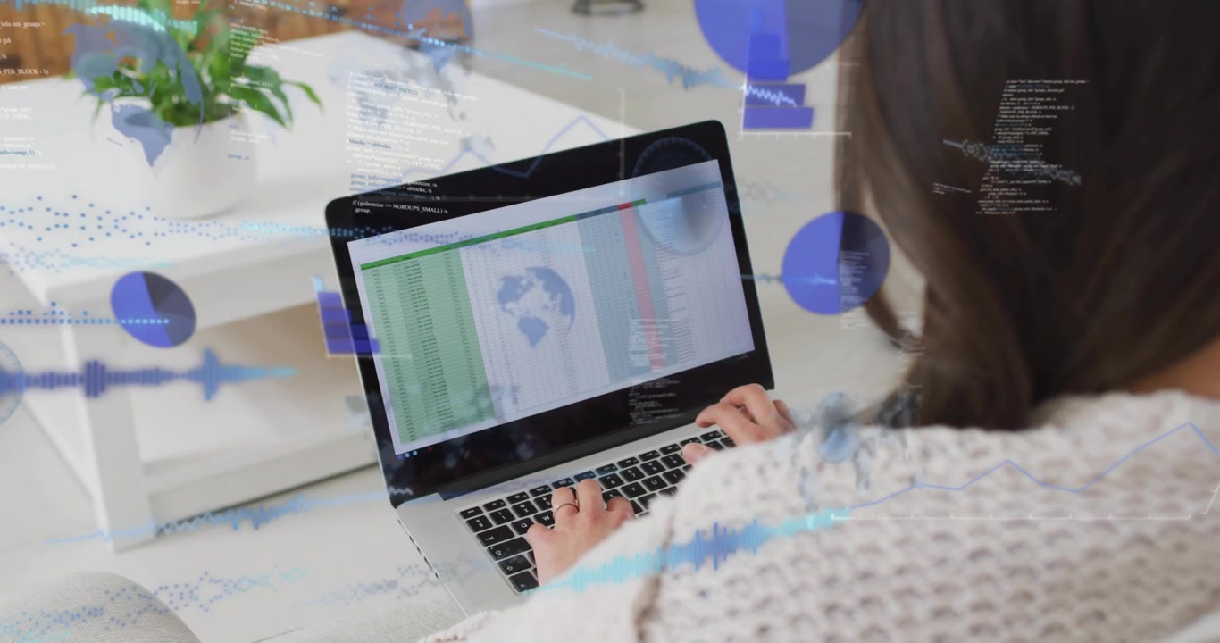 Woman Typing on Laptop with Digital Data Overlays