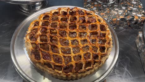 yummy apple lattice pie tart top down shot in cafe display window, australia