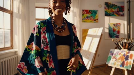 woman painting in a bright art studio
